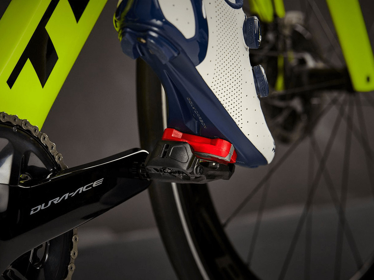 Close-up of road shoe on bike pedal