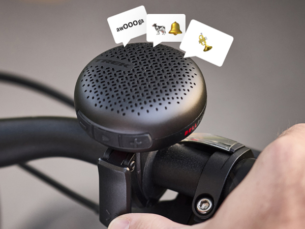 BellBeats mounted to handlebar with emojis in speak bubbles above it