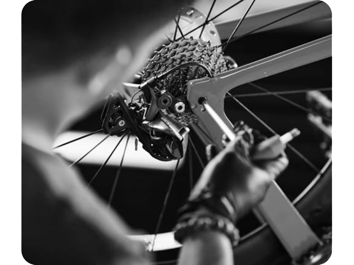 Close up of a black and white Trek Bicycle being tuned