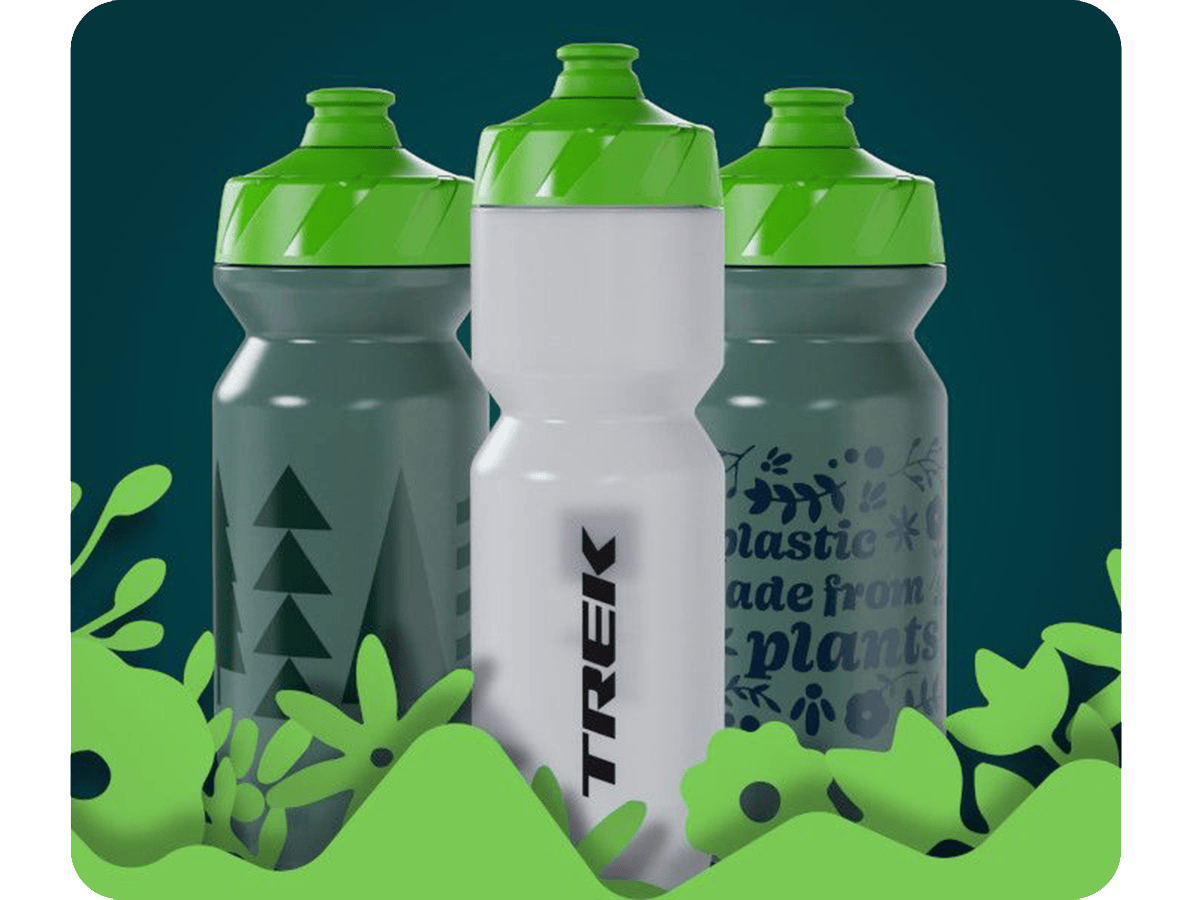 Three Trek recycled bottles with illustrated plants in the foreground